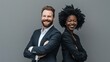 © MD Media - Photo of two happy diverse professional people, smiling at the camera, wearing a business suit dressed in a grey. multi ethnic business couple posing arms crossed copy space and new isolated