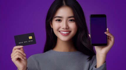 Asian woman holding a credit card with a phone in front of her, contactless online payment for purchases, shopping and discounts