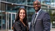 © MD Media - Two business diverse people, wearing professional attire smiling at the camera, Professional Business Portraits of Two Colleagues, Business Team Portrait in Urban Setting