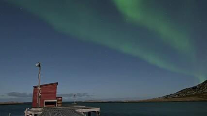 Wall Mural - Aurora borealis in Tufjord in the morning, green, and blue colors.