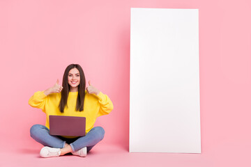 Poster - Full size photo of young girl sit floor show fingers thumb-up approve perfect isolated over pink color background