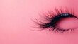 © Khaligo - Long eyelashes showing half closed eye on pink background