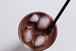 © ibragimova - Cocktail with ice and cube of chocolate. shake concept. cocktail with ice cubes and straw on a white . a cocktail with ice cubes and a straw on a white lifestyle.