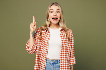 Sticker - Young smart proactive woman she wears red shirt white t-shirt casual clothes holding index finger up with great new idea isolated on plain pastel green background studio portrait. Lifestyle concept.