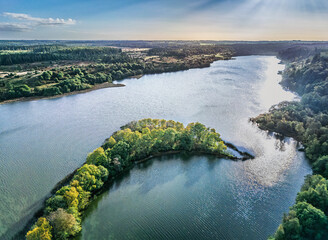 Small Danish lake Rorbaek with green sourroundings in Denmark