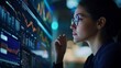 © Oulaphone - A focused professional analyzes financial data on a glowing screen, showcasing concentration and technology in a modern workspace.