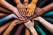 © OMD - A circle of diverse hands placed on top of each other, symbolizing unity and collaboration. The hands show a variety of skin tones and colors against a dark background.