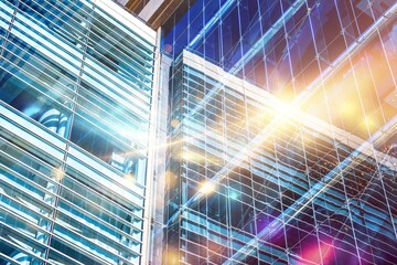 Sticker - Glass facade of a modern skyscraper with a sunny sky reflecting in the windows.