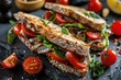 © dashtik - Gourmet Sardine Sandwich with Tomatoes and Arugula on Rustic Bread