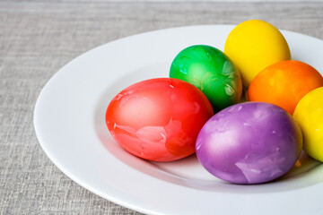 White eggs on a plate for easter. Food holiday spring concept. A plate of colorful eggs for easter. A plate of colorful eggs on a white for easter lifestyle.