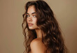 © Milla - Charming glam woman with long wavy hair. Model with curly hairstyle and healthy skin. Beauty, hairstyle, makeup and cosmetics
