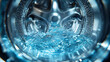 © Siasart Studio - Close-up of water splashing inside a washing machine drum.