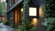 © Siasart Studio - Modern outdoor wall light beside lush greenery in a contemporary setting.