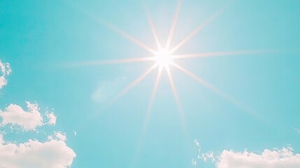 Wall Mural - soft, white clouds floating in a vibrant blue sky, with the sun rays shining through and casting a r