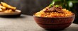© ParinApril - Delicious bowl of rice with beef, garnished with herbs, on a textured background.