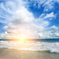 Poster - Sea and colorful sunrise on blue cloudy sky.