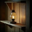 © Theeranan - A vintage oil lamp glowing softly on a wooden shelf, casting a warm, nostalgic light in a dimly lit room