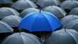© Theeranan - Bright blue umbrella standing tall among gray umbrellas, symbolizing uniqueness and business protection.