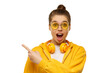 © Damir Khabirov - Young shocked girl, wearing round glasses and headphones on neck, pointing left