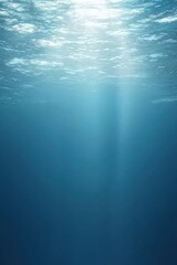 Poster - A serene underwater scene showcasing the calm blue depths illuminated by soft sunlight, perfect for evoking tranquility and exploration.