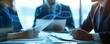 © EmPics - Corporate executive reviewing biotechnology patents with a lawyer close up, focus on, copy space sharp legal documents, double exposure silhouette with DNA sequencing
