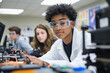 © KeteOne - High school student boy with safety goggles working on electronic circuit board in laboratory, education