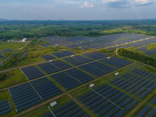 Aerial bird view photo of photovoltaic power station also known as a solar park is large-scale photovoltaic system (PV system) designed for the supply of merchant power into the electricity grid