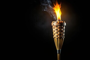 Ancient wooden torch isolated on black background in forced perspective