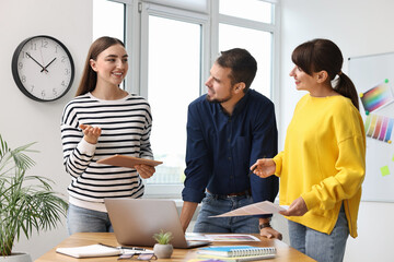 Sticker - Group of designers working together in office