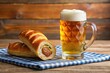 © yuwaree - Bavarian speciality sausage roll with a beer