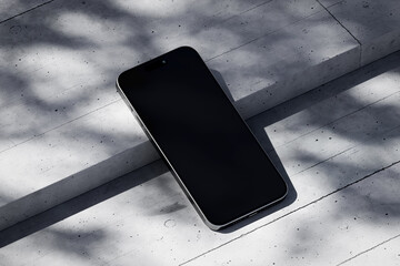 Wall Mural - Phone with a blank screen on a concrete background