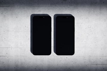 Wall Mural - Two phones with a blank screen on a concrete background