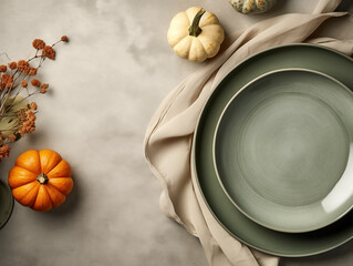 Flat lay composition of autumn harvest pottery and copy space. Rustic stoneware with fall decor. Sage plate on neutral background with pumpkins and herbs. Wabi sabi potteryn. Food blog concept