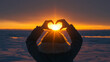 © deimos.az - Woman making a heart with hands outdoors in a frosty sunset, closeup. Winter solstice