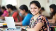 © antusher - Happy Indian student smiling in classroom with laptop and books, surrounded by peers