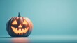 © Johannes - An unlit Halloween Jack O Lantern isolated on a widescreen pale blue background