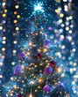 © DeklaDora - Christmas tree with garlands on a blurred background