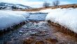 © N0X - Snow melting into a mountain stream, representing the seasonal transformation of water from solid to liquid, snowmelt water, seasonal water power