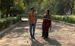 © Dream Lover/Stocksy - Indian couple walking through park