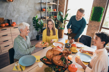 Canvas Print - Photo of four friendly family members pour champagne pass salad plate celebrate thanksgiving dinner apartment indoors