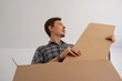 © Milles Studio/Stocksy - Man unpacking new furniture kit