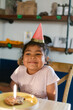 © ByLorena/Stocksy - Party Hat Portrait