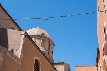 Old buildings, church, architecture against the blue sky in Ortygia old town, Syracuse, Sicily, Italy