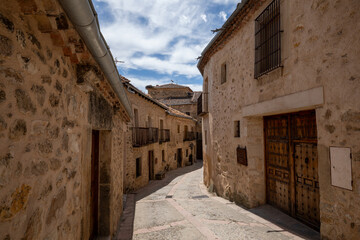 Typical street in the old town of Pedraza, Segovia, Castilla y Leon, Spain, with its medieval houses and alleys