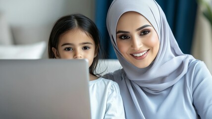 Poster - Mother and daughter smiling together while working on a laptop in a comfortable indoor setting