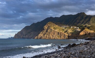 Wall Mural - Ocean coast and beach and moutains at sunset. Port da Cruz Madeira. 