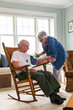 © Raymond Forbes LLC/Stocksy - Senior Veteran house medical Check up for blood pressure