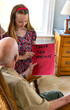 © Raymond Forbes LLC/Stocksy - Young Girl artist hands card portrait thanking veteran tribute