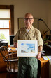 © Raymond Forbes LLC/Stocksy - Senior Painter Artist  man Veteran at home in Studio