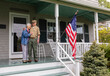 © Raymond Forbes LLC/Stocksy - Senior Citizen  Veteran Portrait at home  with American Flag